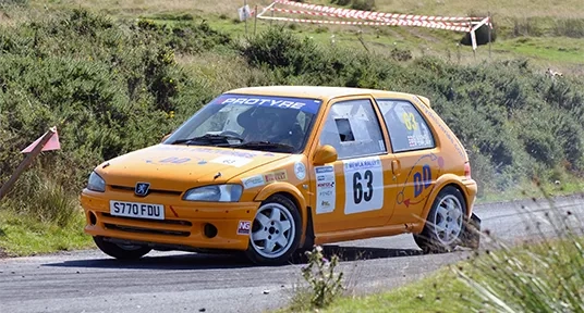 You can’t miss that duck yellow Peugeot!